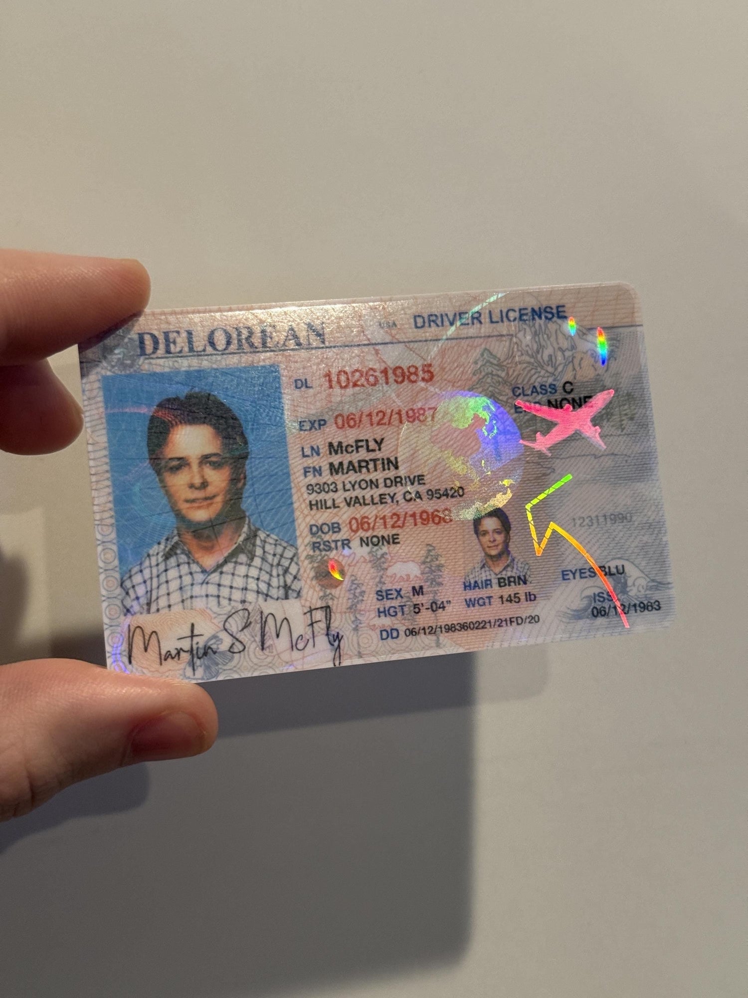 Retro time-travel–style custom PVC card with holographic detail, credit-card size plastic insert