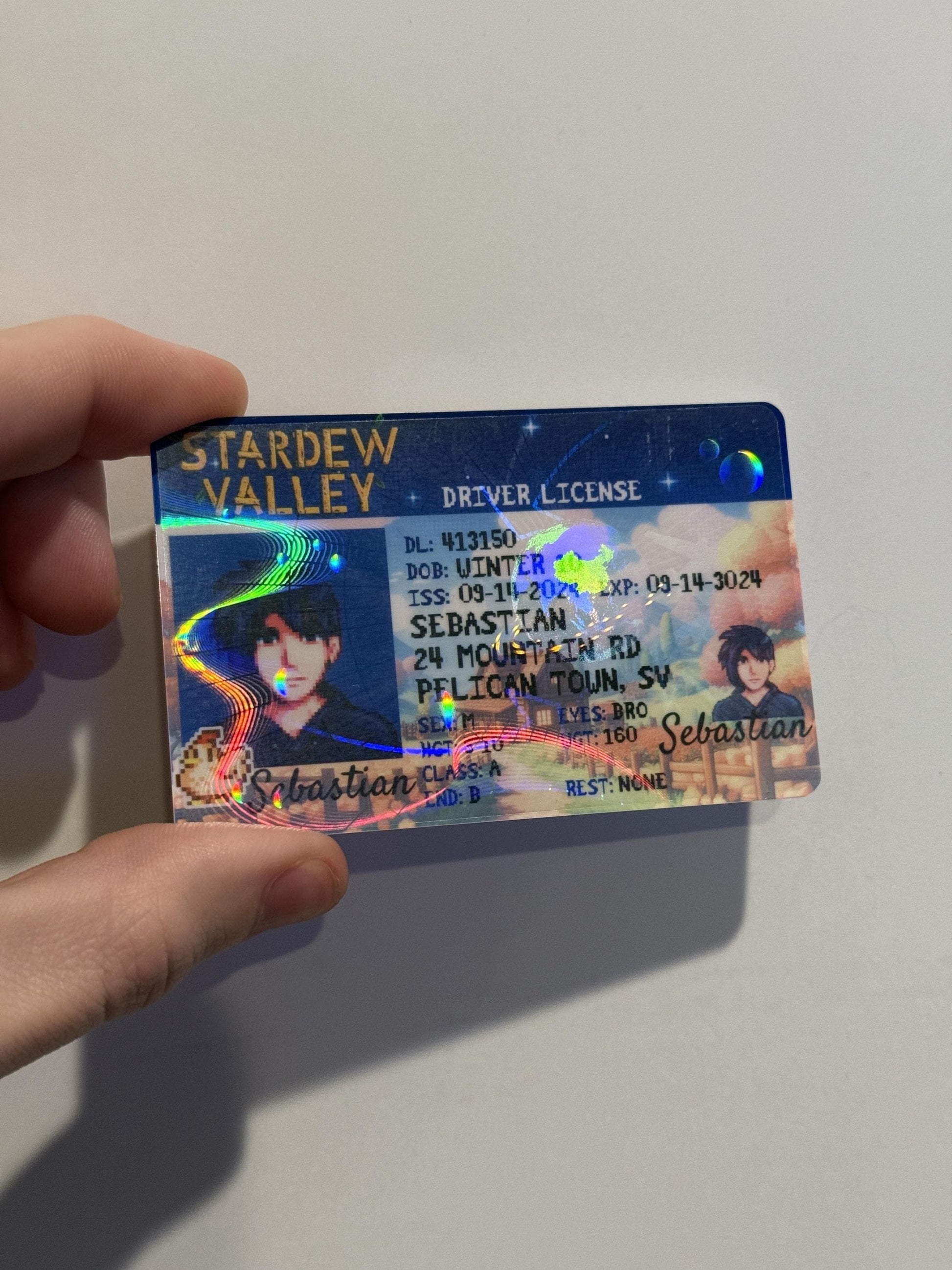 Close-up of Stardew Valley–inspired PVC card showing holographic design and pixel art details